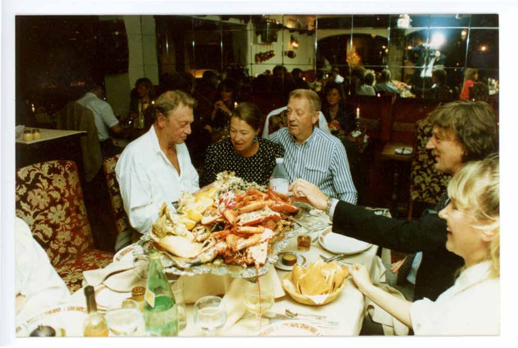 Marshall Doran and family around a lobster platter in the Candlelight Grill at the Hotel Revere