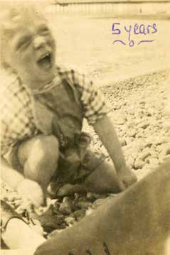 Marshall as a laughing boy, labelled 5 years