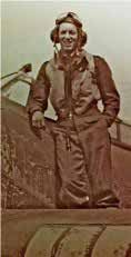 Victor Fenn in flying gear on the wing of a Hurricane fighter