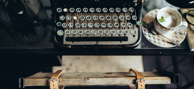 kaboompics.com_Top view of desk with typewriter